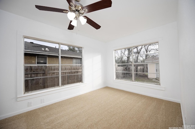 spare room with carpet floors and a healthy amount of sunlight