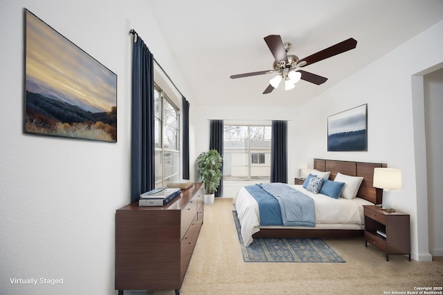 bedroom featuring light carpet and ceiling fan