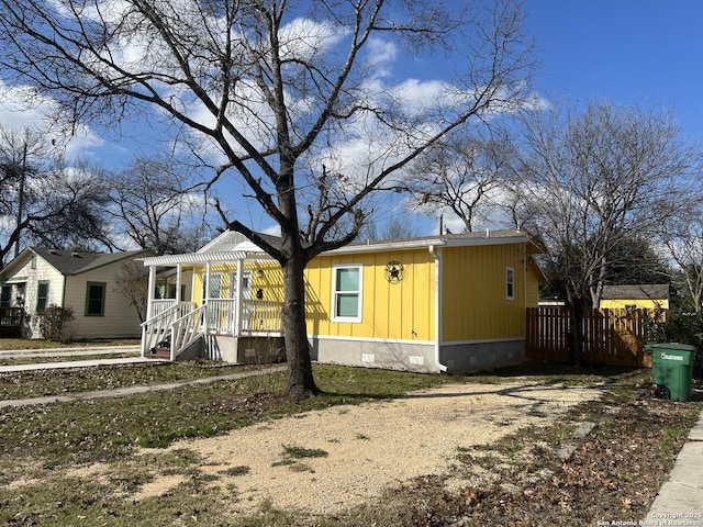 view of front of property with a pergola