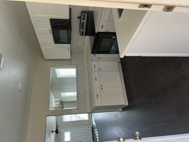 kitchen featuring white cabinets