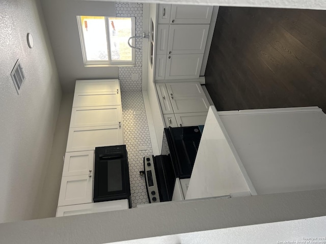 kitchen featuring white cabinetry