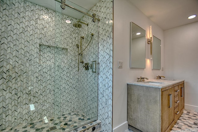 bathroom featuring vanity and a tile shower