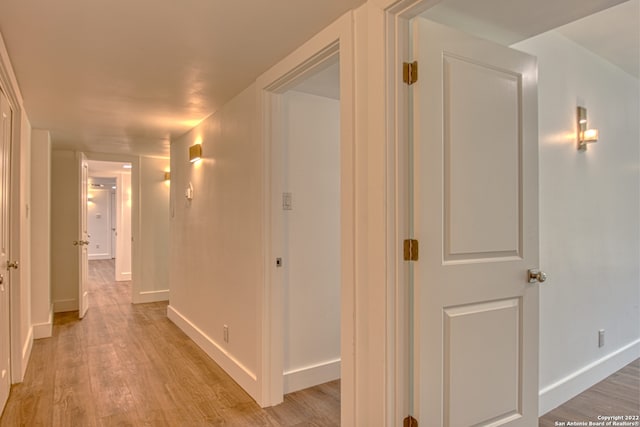 hallway featuring light hardwood / wood-style flooring