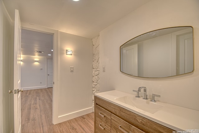 bathroom featuring vanity and hardwood / wood-style flooring