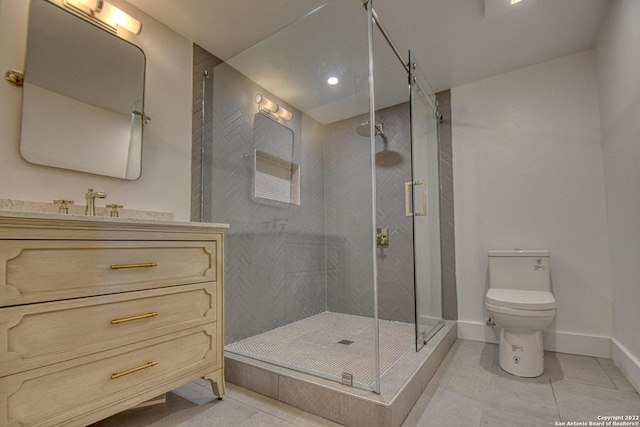 bathroom featuring vanity, toilet, a shower with shower door, and tile patterned flooring