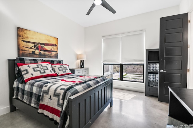 bedroom with ceiling fan and finished concrete flooring