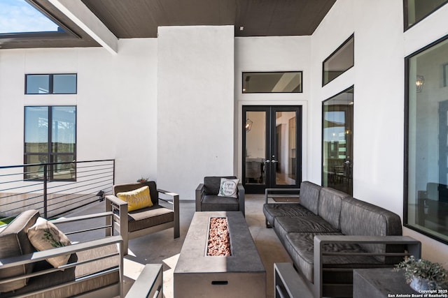 view of patio / terrace with an outdoor living space with a fire pit