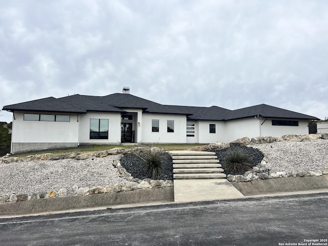 prairie-style house with stucco siding