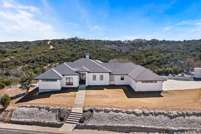 aerial view with a wooded view