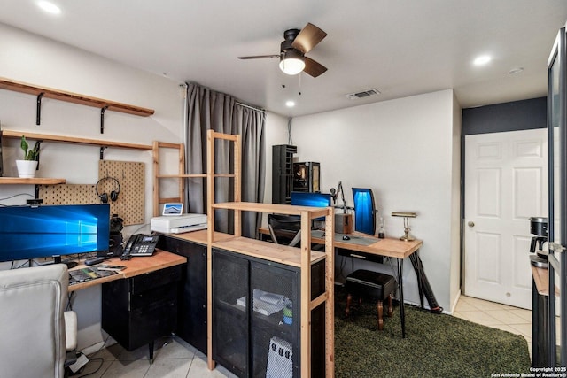 office space featuring ceiling fan and light tile patterned flooring