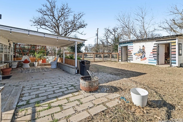 view of patio featuring an outbuilding and an outdoor living space