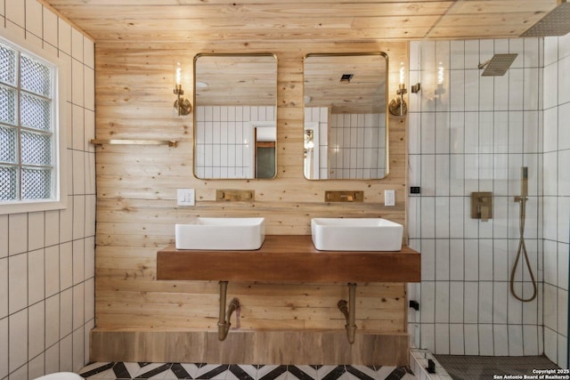 bathroom with vanity, tiled shower, and wooden ceiling