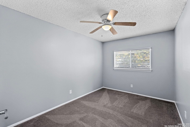 carpeted empty room with ceiling fan and a textured ceiling