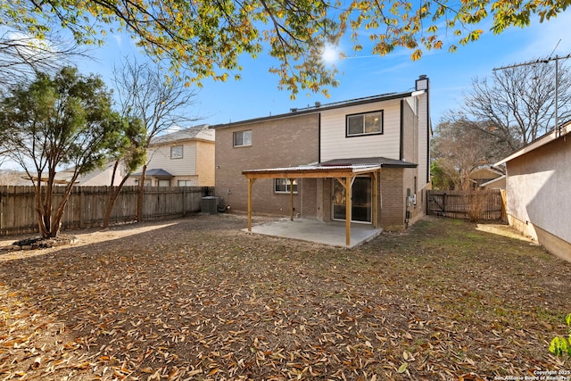 back of property featuring a patio and central air condition unit