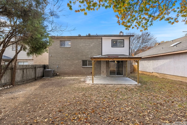 back of property featuring a patio and central AC