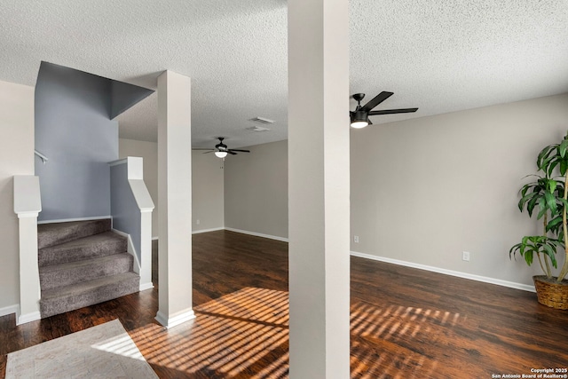 interior space with ceiling fan, hardwood / wood-style floors, and a textured ceiling