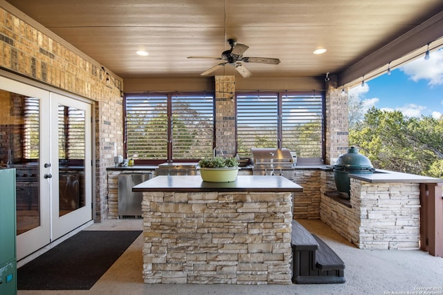 view of patio featuring french doors, area for grilling, and grilling area