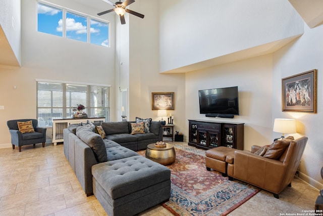 living room with plenty of natural light and ceiling fan