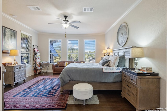 bedroom with dark wood-type flooring, ceiling fan, and ornamental molding