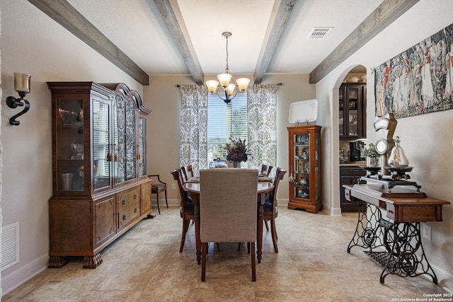 dining room with beamed ceiling and a notable chandelier