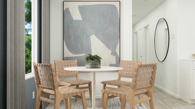 dining area with light hardwood / wood-style flooring