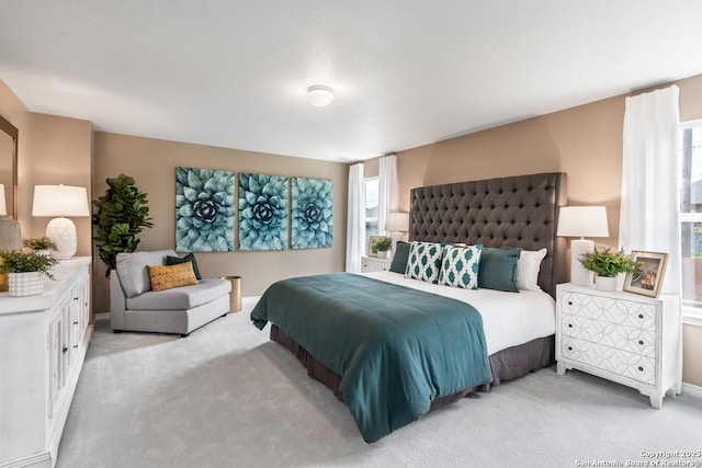 bedroom with light colored carpet