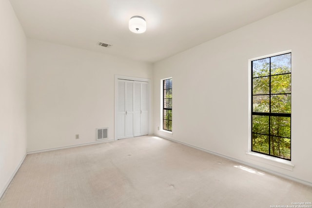 311 Ridge Blf, San Antonio, TX 78216 - carpeted empty room with healthy amount of natural light and baseboards