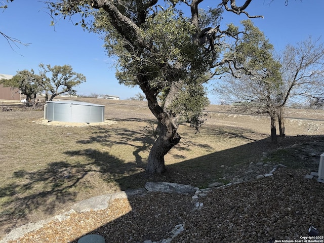 view of yard with a rural view