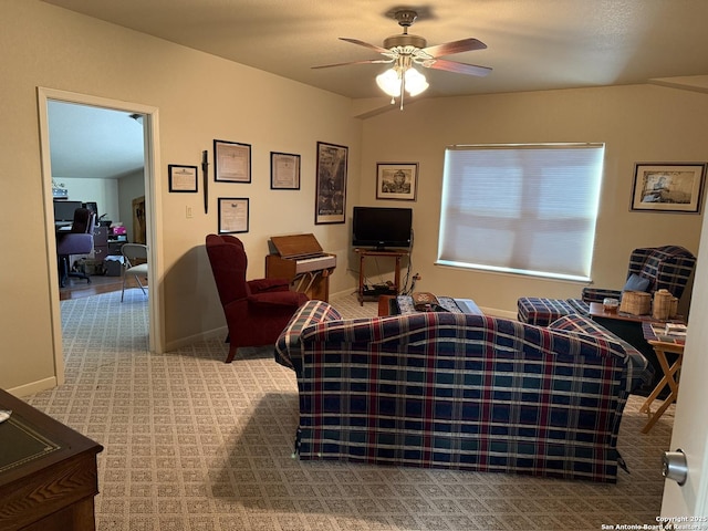 carpeted living room featuring ceiling fan