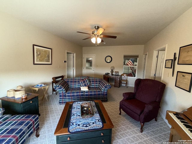 carpeted living room with ceiling fan