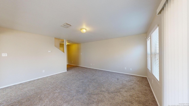 unfurnished room with carpet flooring