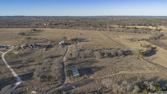 birds eye view of property with a rural view