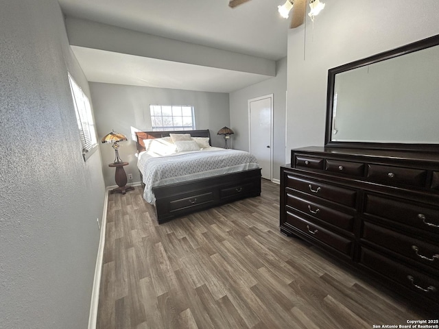 bedroom with ceiling fan and hardwood / wood-style floors