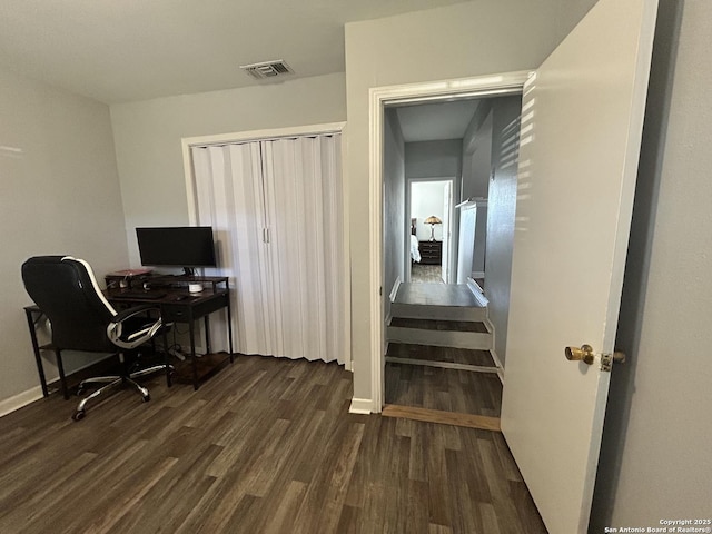 office space with dark hardwood / wood-style flooring