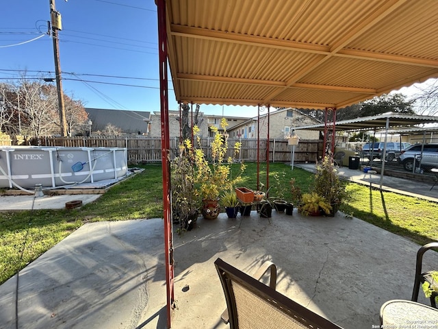 view of patio featuring a fenced in pool