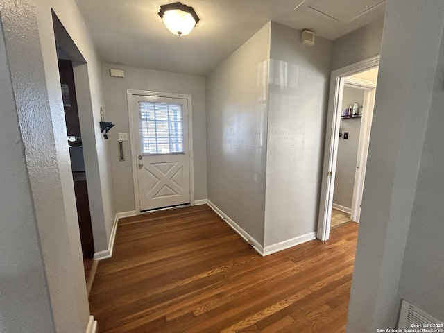 doorway to outside with dark wood-type flooring