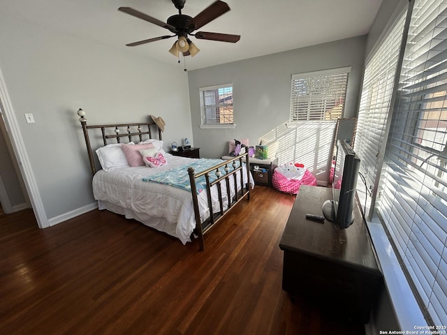 bedroom with dark wood-type flooring and ceiling fan