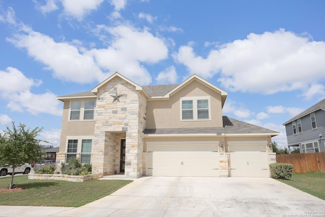 view of front of house with a garage and a front yard