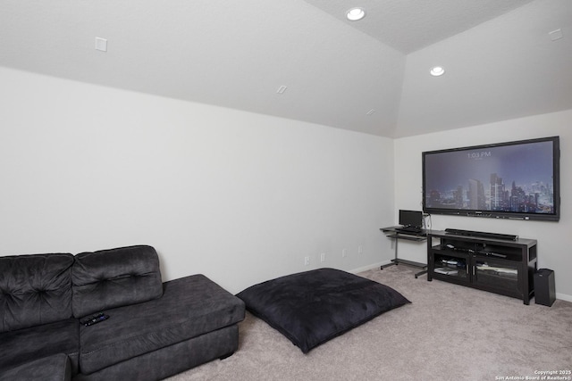 carpeted living room featuring lofted ceiling