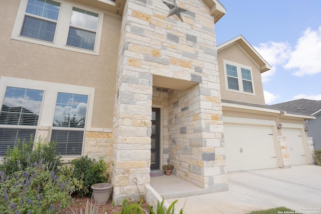 doorway to property featuring a garage