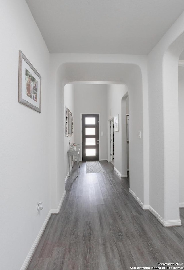 corridor featuring dark wood-type flooring