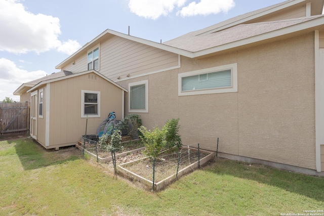 rear view of house with a yard