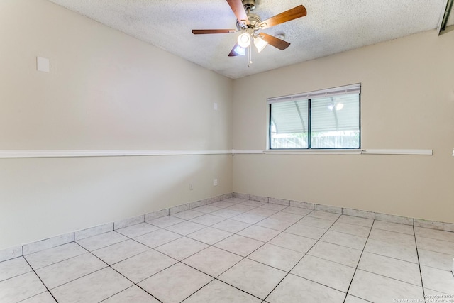 spare room with ceiling fan and a textured ceiling