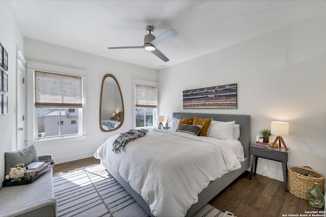 bedroom featuring ceiling fan and dark hardwood / wood-style floors