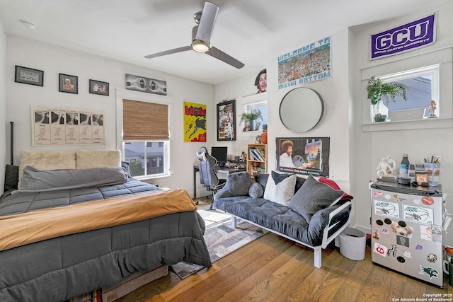 bedroom featuring ceiling fan and wood-type flooring