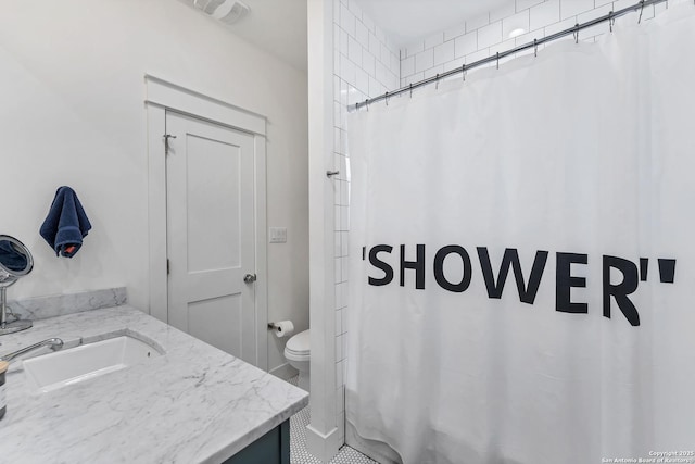 bathroom featuring vanity, toilet, and walk in shower