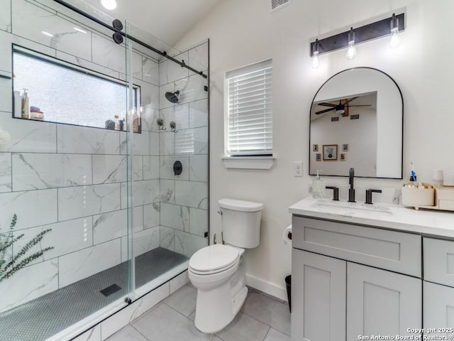 bathroom with a shower with shower door, tile patterned flooring, vanity, ceiling fan, and toilet