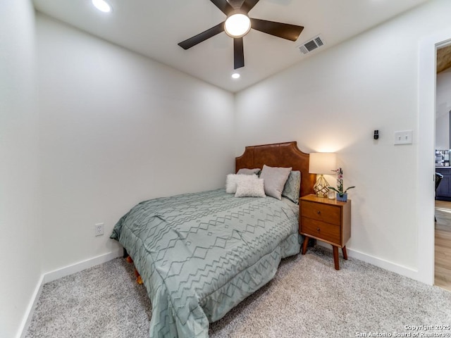 bedroom with ceiling fan and carpet floors