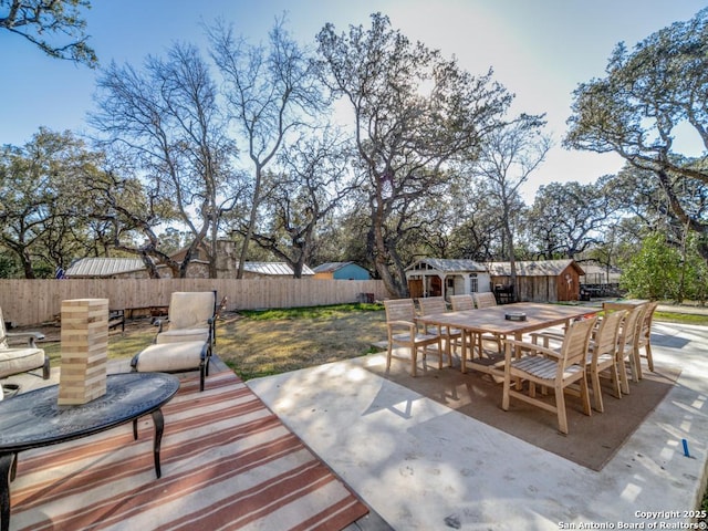 view of patio / terrace with a shed