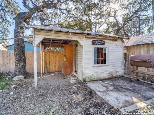 view of outbuilding with a hot tub